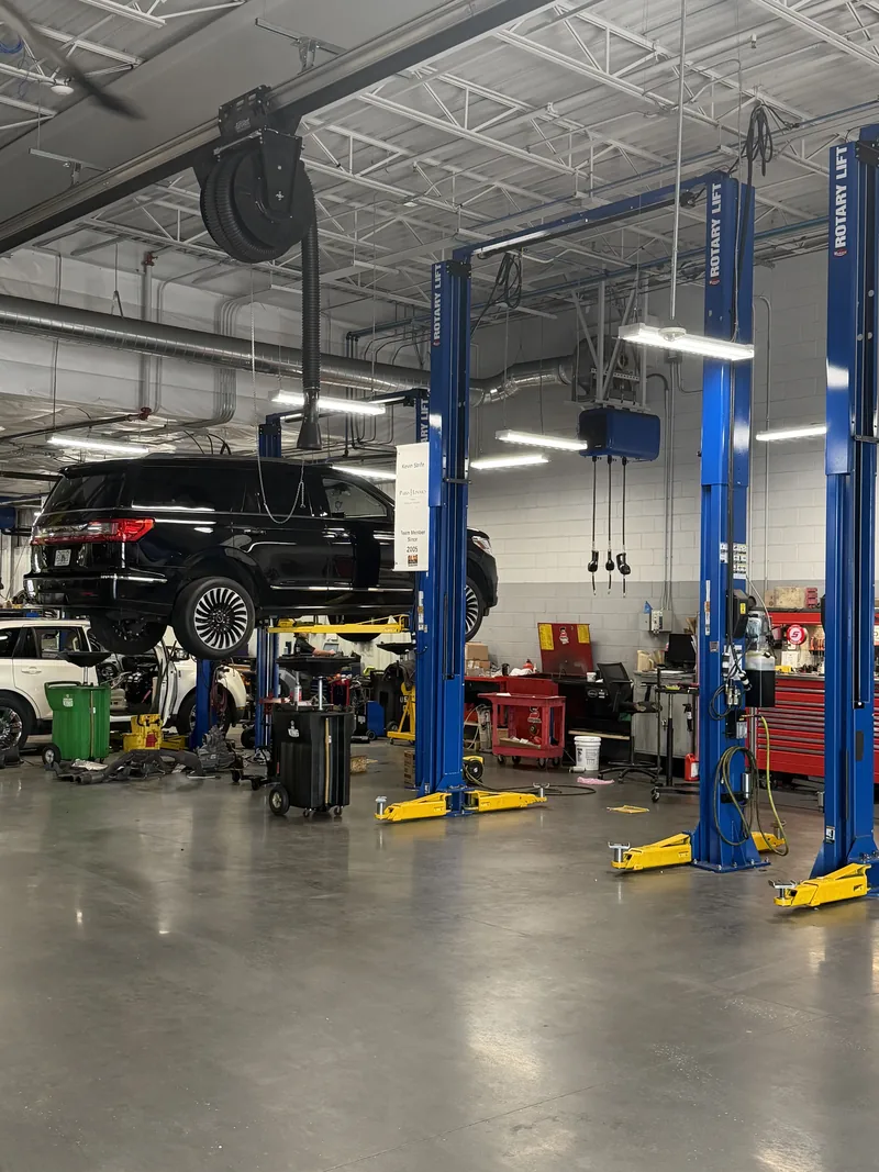 Rotary two-post lifts in a dealership service department